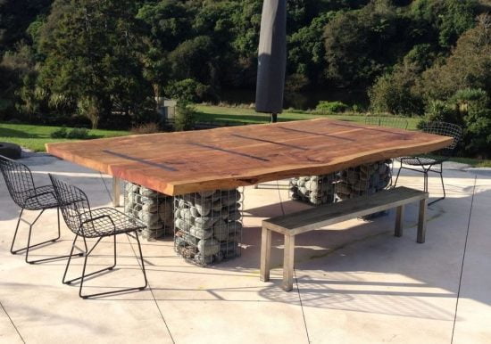 Wooden tables and chairs and gabions
